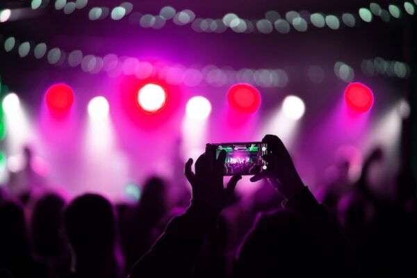 close up recording video with smartphone during concert 1153 7310